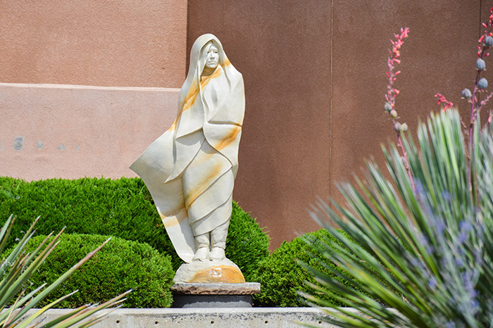 image of a statue in the courtyard at UNM-Gallup