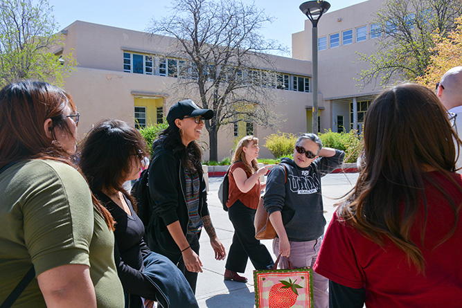 Student Kayliegh Begay, center left, who graduated from The University of New Mexico-Gallup, connects with the Art Student Collective during a tour of the UNM main campus in Albuquerque on April 4, 2025.