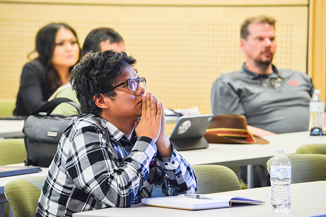 UNM-Gallup student Dewight Leupp listens to Navajo Nation President Buu Nygren’s keynote address on economic development at UNM-Gallup on Wednesday, May 14, 2025.
