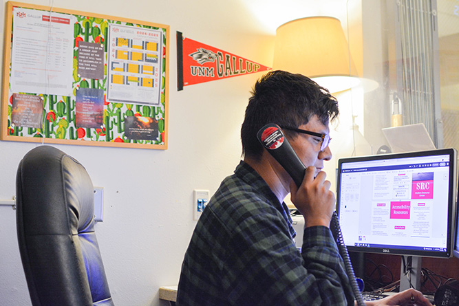 Dewight Leupp works the front desk of the Student Resource Center at The University of New Mexico-Gallup on Wednesday, June 25, 2025. Leupp is hired through the Navajo Department of Workforce Development. The SRC is his job site.