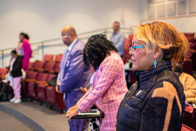 Diversity, Equity & Inclusion work-study student Tara Ashley and others in attendance pray during the Martin Luther King Jr. Commemorative Service at The University of New Mexico-Gallup on Saturday, Jan. 31, 2026.
