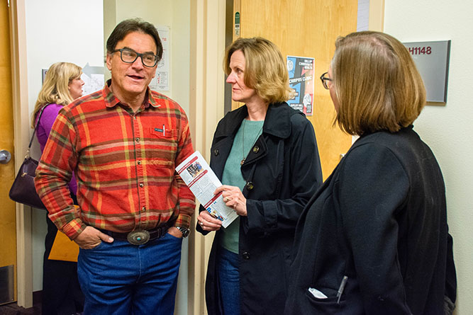 Gallup Mayor Marc DePauli and his wife Kristy DePauli speak with Kris Pikaart, the director of behavioral health services and school-based clinics for Gallup Community Health, during the open house for the new Campus Clinic at The University of New Mexico-Gallup on Wednesday, Feb. 11.