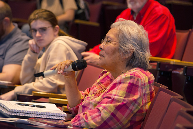 Darlene Silversmith, a student at The University of New Mexico-Gallup, asks a question at the end of Dr. Nancy J. Hamilton’s lecture in the Calvin Hall Center Auditorium on Wednesday, March 25, 2026. Photo by Taylor Benny/UNM-Gallup.