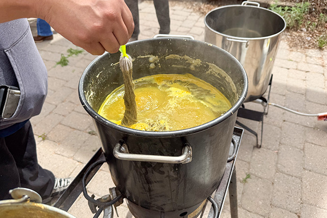 In this photo, a student shows the wool dye progress in downtown Gallup on Friday, April 10, 2026.