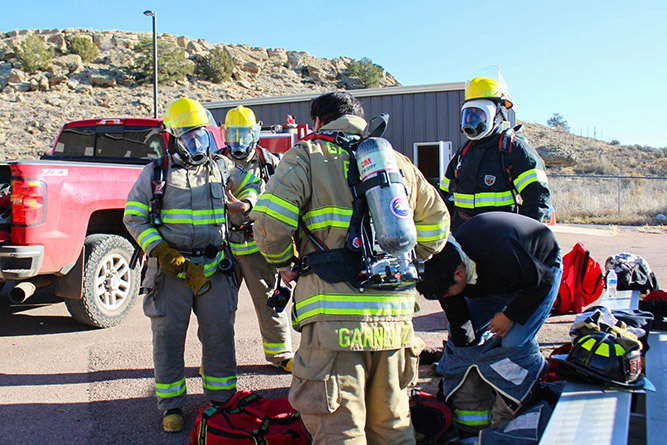 UNM-Gallup Center for Career and Technical Education students gear up at the McKinley County Fire Office in Gallup.