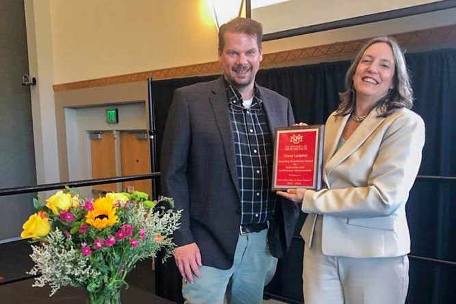 In this courtesy photo, Interim Chancellor John Zimmerman and Associate Professor Tracy Lassiter pose for a photo during The University of New Mexico Teaching Excellence Awards Ceremony in Albuquerque on April 8, 2026.