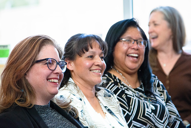 From left: Amber Gallup, Sadie Acevedo, Jacinta Sice and Sabrina Ezzell share a laugh during the 2026 Adult Basic Education Graduation Ceremony in Zollinger Library at The University of New Mexico-Gallup on April 28, 2026.