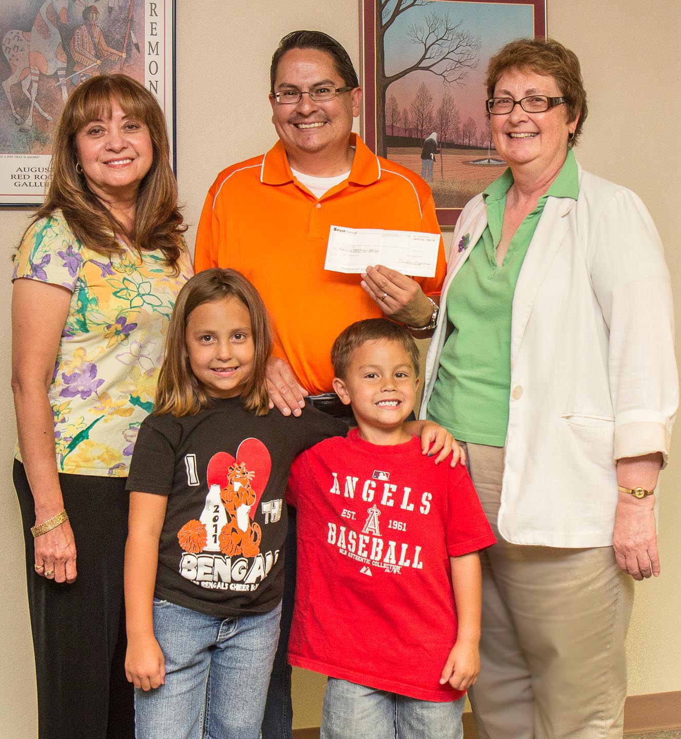 Caption: From left; (back) Dr. Sylvia Andrew, executive director; Dr. Lawrence Andrade; Marji Campbell, director of the UNMG Nursing program; (front) Xavier and Iliana Andrade.