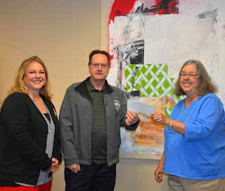 UNM-Gallup staff receiving scholarship donation