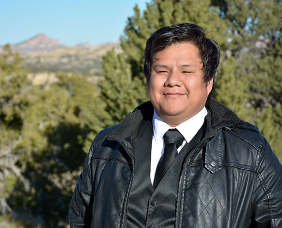 Dewight Leupp, a first-generation college student pursuing an associate degree in liberal arts, poses for a photo on The University of New Mexico-Gallup campus Nov. 16, 2022.